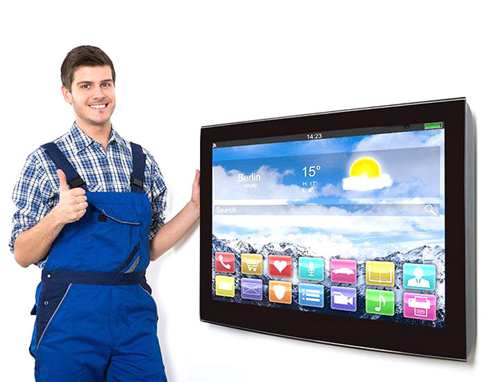 repairman standing next to TV